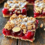 You can use either fresh or frozen cherries for this recipe. I find fresh cherries add a nice bite. If you choose frozen, thaw them first. Remove the pits and cut them in half. You'll need about 2 cups of cherries. For sweetness, you can use honey or maple syrup. Just one tablespoon is enough to enhance the cherries' natural taste. Add one tablespoon of lemon juice for some zing. Don't forget to include one teaspoon of almond extract. This gives your bars a lovely almond flavor. The dry mix is simple and essential. Start with 1 cup of all-purpose flour and 1 cup of rolled oats. These provide the base for your bars. Next, add ½ cup of brown sugar for sweetness. Include ½ teaspoon of baking powder to help them rise. Finally, add ½ teaspoon of salt to balance all the flavors. Melt ½ cup of unsalted butter and mix it in. Top it off with ½ cup of sliced almonds for crunch. First, set your oven to 350°F (175°C). This is the perfect heat for baking. Next, grab an 8x8 inch baking dish. Line it with parchment paper. Leave some paper hanging over the edges. This will help you lift the bars out later. In a small bowl, take your cherries. You can use fresh or frozen. Add 1 tablespoon of lemon juice. Then, mix in 1 tablespoon of honey or maple syrup. Toss the cherries well. Set this bowl aside. The juices will mix and add flavor. In a large bowl, combine the flour, rolled oats, brown sugar, baking powder, and salt. Mix these dry ingredients well. Then, pour in the melted butter and almond extract. Stir until you get a crumbly mix. Now, take half of this mixture. Press it into the bottom of your baking dish. This creates a nice base. Next, spread the cherry mixture evenly over this crust. Make sure to distribute the cherries well. Finally, take the rest of the crumble mixture. Sprinkle it over the cherries. Add the sliced almonds on top. Bake your bars in the oven for about 30-35 minutes. Look for a golden brown top and bubbly cherries. Once baked, take the dish out of the oven. Let it cool for 10 minutes. Use the parchment paper to lift it out. Allow it to cool completely on a wire rack. If you want, dust it with powdered sugar before serving. Enjoy your delicious Cherry Almond Crumble Bars! When picking cherries, aim for fresh, ripe ones. Look for bright color and firmness. If you use frozen cherries, thaw and drain them first. This keeps the bars from getting too soggy. Sweet cherries work best for these bars. Sour cherries can add a nice tang if you enjoy a bit of tartness. For a great crumble, mix the dry ingredients well. Combine flour, oats, brown sugar, baking powder, and salt. When you add melted butter, stir until crumbs form. Don't overmix; you want some texture. The perfect crumble is buttery and holds together. Press half into the pan firmly for a strong base. These bars are great warm or cold. You can dust them with powdered sugar for a special touch. Serve them with a scoop of vanilla ice cream for a dessert treat. They also pair well with coffee or tea. Pack them for lunch or a picnic. Enjoy sharing them with friends and family! {{image_2}} You can swap cherries for other fruits. Try blueberries, raspberries, or peaches. Each fruit brings a unique taste. Blueberries add a sweet burst. Raspberries offer a tart kick. Peaches give a juicy, summer vibe. Just keep the same amount. Adjust sweetness based on the fruit. Need a gluten-free version? Use almond flour or oat flour instead of regular flour. Both options work well in this recipe. Rolled oats are naturally gluten-free, but check the label. This change keeps the bars soft and tasty. You won’t miss the gluten! Want to spice things up? Add cinnamon or nutmeg to the crumble mix. Just a pinch can enhance the flavor. Consider adding vanilla extract for more depth. Each spice brings warmth and comfort to your bars. Mix and match to find your favorite combo! To keep your cherry almond crumble bars fresh, store them in an airtight container. Place parchment paper between layers to avoid sticking. They can stay at room temperature for up to three days. If you want them to last longer, refrigerate them for up to a week. When you're ready to enjoy your bars again, preheat your oven to 350°F (175°C). Place the bars on a baking sheet. Heat them for about 10 minutes. This helps restore their lovely, warm texture. You can also use a microwave. Heat for 15-20 seconds, but watch closely to avoid overheating. To freeze, cut the bars into squares first. Wrap each square tightly in plastic wrap, then place them in a freezer-safe bag. They can stay in the freezer for up to three months. When you're ready to eat them, let them thaw in the fridge overnight or at room temperature for a few hours. Enjoy a taste of summer anytime! Yes, you can use frozen cherries. They are great when fresh ones are not in season. Just thaw and drain them before mixing. This helps keep the bars from being too watery. The flavor stays rich and sweet, just like fresh cherries. Look for a golden-brown top. The edges should be firm and the center slightly jiggly. The cherries will bubble up, showing they are cooked. Bake for about 30-35 minutes at 350°F (175°C). Let them cool before slicing to get neat bars. You can use walnuts or pecans instead. If you want a nut-free option, try sunflower seeds or pumpkin seeds. These options add crunch without the nut flavor. You can also skip the nuts altogether if you prefer a simpler taste. We explored how to make amazing cherry almond crumble bars. We discussed ingredients, like fresh or frozen cherries and the best sweeteners. I provided clear steps for prepping, mixing, and baking. You now have tips for picking cherries and perfecting the crumble's texture. We even explored fun variations and smart storage methods. These bars are tasty and easy to customize. Enjoy them warm or cold. Keep experimenting until you find your favorite twist!
