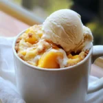 - 1 ripe peach, chopped - 3 tablespoons all-purpose flour - 2 tablespoons granulated sugar - 1/8 teaspoon baking powder - 1/8 teaspoon cinnamon - Pinch of salt - 3 tablespoons milk - 1 tablespoon vegetable oil - 1/2 teaspoon vanilla extract - 1 tablespoon brown sugar (for topping) - Optional: Vanilla ice cream (for serving) Gathering the right ingredients is key to making a great Microwave Peach Cobbler Mug Cake. First, you need a ripe peach. Make sure it is soft and sweet. This fruit adds flavor and moisture. Next, grab some all-purpose flour. This will give the cake its structure. You will also need granulated sugar for sweetness. Baking powder helps the cake rise. A touch of cinnamon adds warmth and a nice flavor. Don’t forget the pinch of salt. It balances the sweetness. For the wet mix, you need milk, vegetable oil, and vanilla extract. These ingredients create a smooth batter. Lastly, use brown sugar on top. It makes a sweet crust. If you like, add a scoop of vanilla ice cream. This makes your dessert even better. With these ingredients ready, you can start making your mug cake. It’s quick and fun! First, grab a microwave-safe mug. In your mug, combine the dry ingredients. Add the chopped peach, flour, granulated sugar, baking powder, cinnamon, and salt. Mix well until the dry ingredients coat the peach pieces. This helps spread the flavor evenly. Next, it’s time to add the wet ingredients. Pour in the milk, vegetable oil, and vanilla extract. Stir everything together until you have a smooth batter. Make sure there are no lumps. A good mix is key for a soft cake. Now, let’s add the brown sugar topping. Sprinkle it on top of your batter. This will create a tasty, caramelized crust when cooked. Microwave your mug cake on high for 1 minute and 30 seconds. After that, check if it’s done. If it’s a bit wet in the middle, microwave it for another 10-15 seconds. Keep an eye on it, as microwave times can vary. Once it’s cooked, let the mug cake cool for about a minute. This makes it easier to eat. For a special touch, serve the mug cake warm. Add a scoop of vanilla ice cream on top. You can also drizzle honey or sprinkle more cinnamon for extra flavor. Enjoy your simple and sweet treat! To get a great mug cake, you must check for doneness. After microwaving, poke the center with a toothpick. If it comes out clean, your cake is ready. If it’s still wet, microwave it for an extra 10-15 seconds. This small step makes a big difference in texture. Remember, microwaves vary in power. Some cook faster than others. If your microwave is strong, check the cake at 1 minute. If it's weak, you might need the full 1 minute and 30 seconds. Always watch closely to avoid overcooking. Toppings can take your mug cake to the next level. I love adding a scoop of vanilla ice cream on top. It melts into the warm cake and adds creaminess. You can also drizzle honey for extra sweetness. A sprinkle of extra cinnamon adds a lovely touch. For a fun twist, try adding spices. You can mix in ginger or nutmeg for a different taste. If you like nuts, sprinkle some chopped pecans or walnuts on top. Each of these options can change the flavor profile and make your mug cake unique. {{image_2}} You can swap out peaches for other fruits. Apples work great in this mug cake. Just chop them up like you would with peaches. Berries are another fun choice, too. Try blueberries or raspberries for a tart twist. Mixing fruits is also a hit. Combine peaches with berries for a fruity explosion. You can even add some chopped nuts for crunch. This keeps the flavor fresh and fun. If you need a gluten-free version, use almond flour or coconut flour. Both work well in this mug cake. They keep it light and fluffy. For a dairy-free option, substitute milk with almond or oat milk. You can also skip the ice cream or use a dairy-free version. These swaps make the dish friendly for many diets. To store your leftover mug cake, let it cool first. Then, cover the mug with plastic wrap or a lid. You can keep it in the fridge for up to two days. This keeps it fresh and tasty. If you want to reheat it, place the mug in the microwave. Heat it for about 15 to 20 seconds. Check to see if it's warm enough. If not, add a few more seconds. You can prepare some ingredients ahead of time. Chop the peach and store it in a small bowl. Keep it in the fridge until you are ready to use it. You can also mix the dry ingredients and store them in a jar. When you want a quick treat, just add the wet ingredients. For quick serving, warm your mug cake in the microwave for about 30 seconds, or until it's nice and hot. This way, you can enjoy a sweet dessert in no time. Making this mug cake is quick and easy. It takes about 5 minutes to prep. Cooking in the microwave takes 1 minute and 30 seconds. So, the total time is just 2 minutes and 30 seconds. You can enjoy a warm dessert in no time! Yes, you can use frozen peaches! Just remember to thaw them first. Drain any extra juice after thawing. Frozen peaches can work well, but fresh peaches give a better taste. Fresh fruit adds a nice texture and flavor. If your mug cake is dry, this could be due to too much flour or cooking too long. To keep it moist, use the right flour amount. Also, check your microwave time. If it feels dry, try adding a bit more milk next time. This will help make it softer and more delicious! This blog post shared a simple microwave peach cobbler mug cake recipe. We covered ingredients, steps, and tips for perfecting your cake. You learned how to enhance flavors and explore variations with different fruits. Proper storage and reheating methods help keep your dessert tasty. With these easy steps, you can enjoy a quick treat anytime. Experiment with flavors and enjoy the fun of baking in a mug!